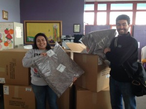 Program Assistant, Laura Rodriguez, and Community Outreach Coordinator, Ben Ranz, with blanket donation from St. Vincent de Paul.