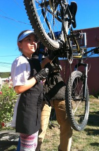 Emerald Webb tries her had at bike repair